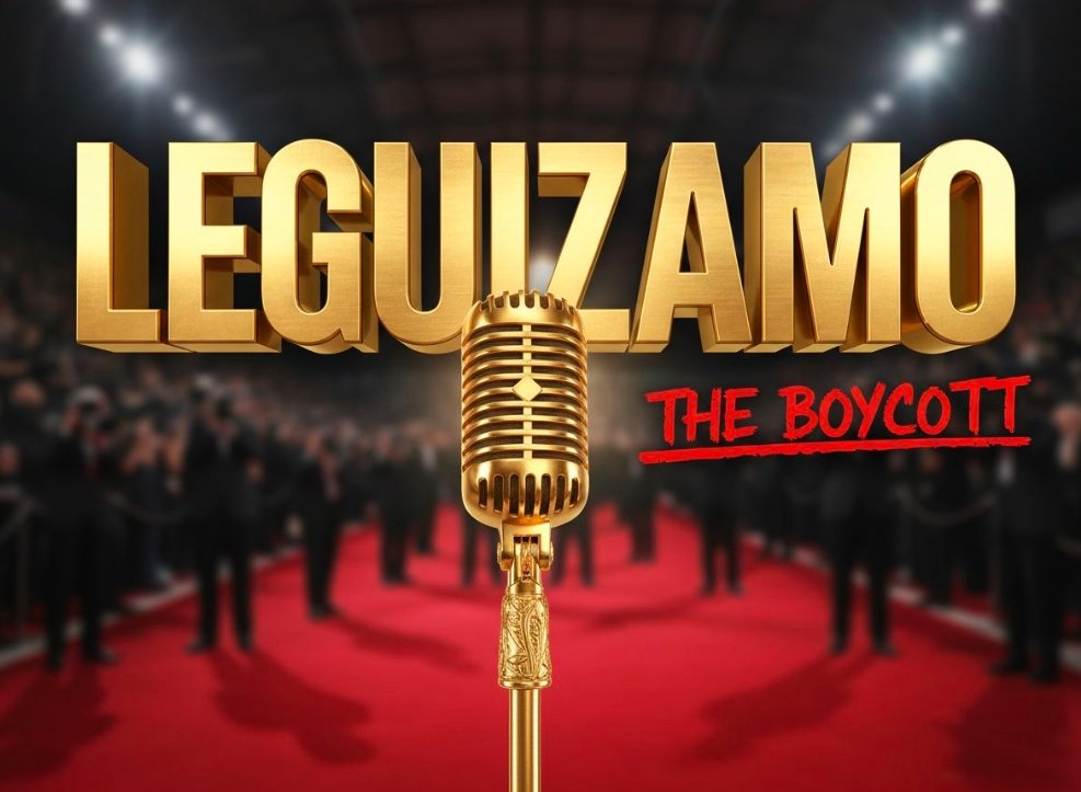 John Leguizamo speaking serious expression dark background microphone