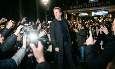 Jerry Seinfeld walking past crowd at NBA Finals game