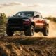 2027 Ram 1500 TRX SRT airborne over a dirt track