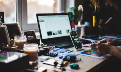 side hustler crafting at a home workspace with marketplace dashboard
