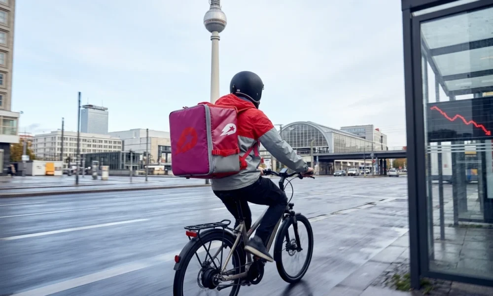Uber Delivery Hero €13 billion takeover deal Berlin headquarters