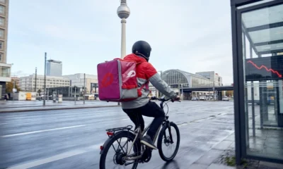 Uber Delivery Hero €13 billion takeover deal Berlin headquarters