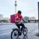 Uber Delivery Hero €13 billion takeover deal Berlin headquarters