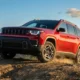2026 Jeep Cherokee hybrid boxy red SUV dirt trail standard AWD