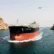 drone strike tanker Strait of Hormuz oil spike crypto