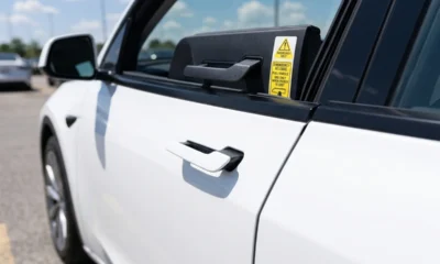 Tesla flush door handle China recall emergency release labels