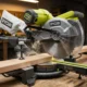 Ryobi TSS121 sliding miter saw cutting workbench lumber